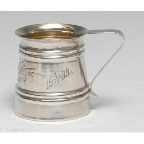 204 - A Russian silver Christening mug, bright-cut engraved, angular scroll handle, gilt interior, 5.5cm h... 