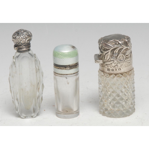 239 - A Victorian silver mounted hobnail-cut glass cylindrical scent bottle, hinged cover chased with flow... 