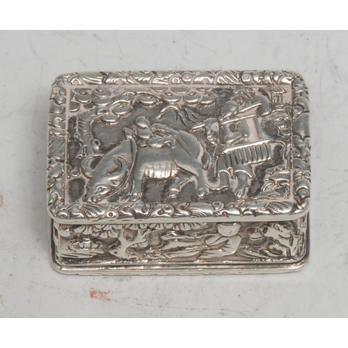 85 - A Chinese silver rectangular vinaigrette, in relief with young boys in landscapes and riding a buffa... 