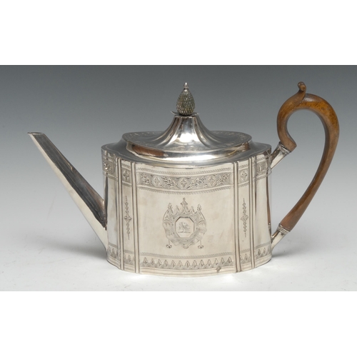 101 - A George III Irish silver commode shaped teapot, hinged lofty fluted cover with pineapple finial, br... 