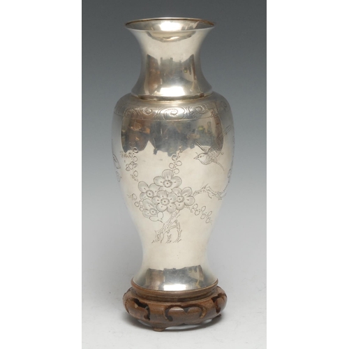 83 - A Chinese silver ovoid vase, engraved with butterflies and blossoming prunus, 19cm high, marked Ster... 