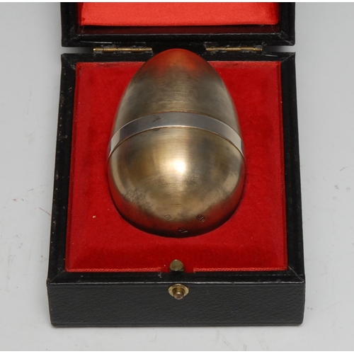 327 - Stuart Devlin (1931 - 2018) - an Elizabeth II silver-gilt and silver surprise egg, enclosing a lepre... 