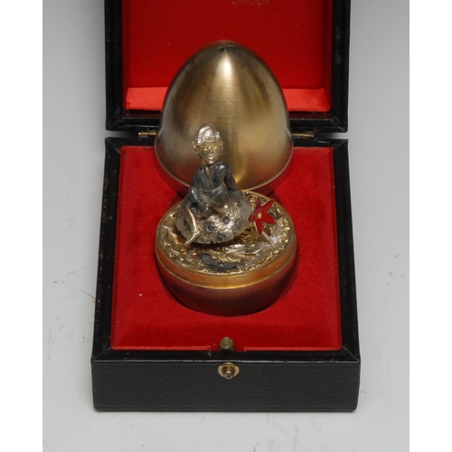 327 - Stuart Devlin (1931 - 2018) - an Elizabeth II silver-gilt and silver surprise egg, enclosing a lepre... 