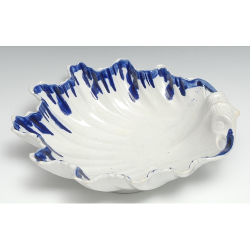 443 - An 18th century large pearlware shell shaped dish, dripped blue border, 28cm wide, c.1790