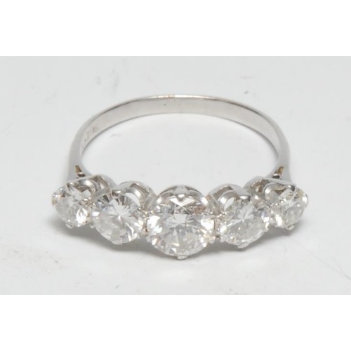 365 - A five stone diamond line ring, linear set with five graduated round brilliant cut diamonds from app... 