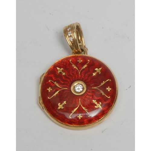 362 - A Faberge limited edition circular red enamel and diamond inset 18ct gold circular locket, round bri... 