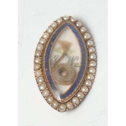 370 - A George III gold coloured metal navette shaped mourning brooch, enclosing a lock of hair and initia... 