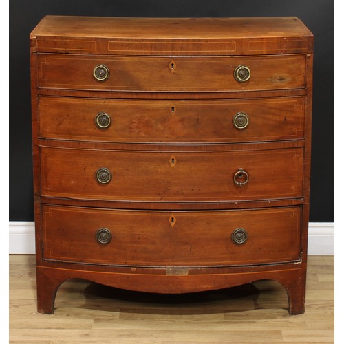 1980 - A George IV mahogany bow front chest, flush top above four long graduated cockbeaded drawers, inlaid... 