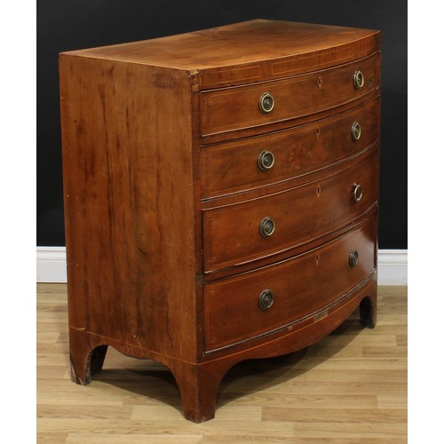 1980 - A George IV mahogany bow front chest, flush top above four long graduated cockbeaded drawers, inlaid... 