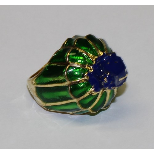 645 - A base metal dress ring, green and blue enamel, surmounted with a frog, size L