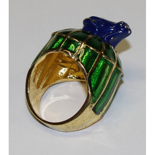 645 - A base metal dress ring, green and blue enamel, surmounted with a frog, size L