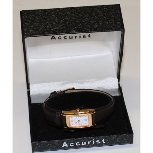 654 - An Accurist lady's 9ct gold and stainless steel watch, boxed