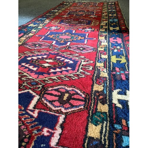 93 - A Middle Eastern, Hamadan type Runner Carpet; hand-knotted with a geometric design predominantly in ... 