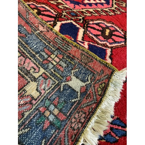 93 - A Middle Eastern, Hamadan type Runner Carpet; hand-knotted with a geometric design predominantly in ... 