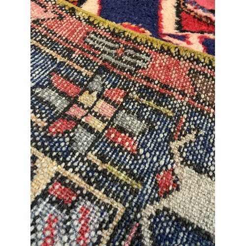 93 - A Middle Eastern, Hamadan type Runner Carpet; hand-knotted with a geometric design predominantly in ... 