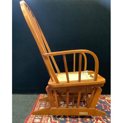 96 - A Dutailier 20th century pine bentwood rocking chair, 100cm high