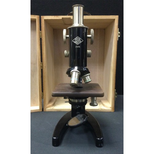 118 - A Prior of London monocular microscope, triple revolving optic mount, black body, no 17073, cased