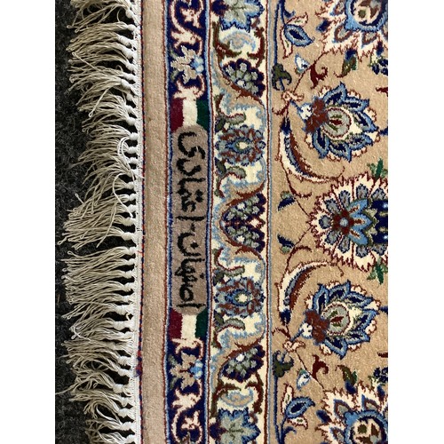 124 - A Persian Isfahan Rug, the fine, short wool pile and silk carpet woven in shades of deep blue, azure... 