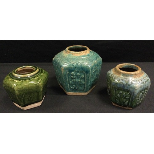 180 - A Tang style Chinese stoneware vase, probably 19th century, and two conforming small vases, (3).