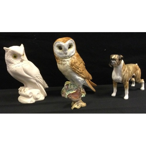 191 - A Beswick model Standing Boxer dog; others Owl 1046, Wren 993, matt;  novelty owl  (4)