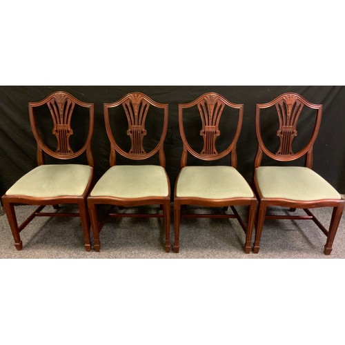 257 - A set of four early nineteenth century style reproduction wheatsheaf back dining chairs, (4).