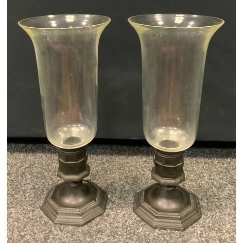 332 - A pair of 19th century candle lamps, cast metal octagonal base, spreading stepped foot, clear glass ... 