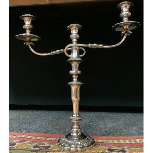 333 - A large 19th century silverplated table stick, twin scrolling arms, sectional ornate column, grape v... 