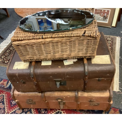 336 - A brown luggage trunk, another;  wicker basket, wall mirror (4)