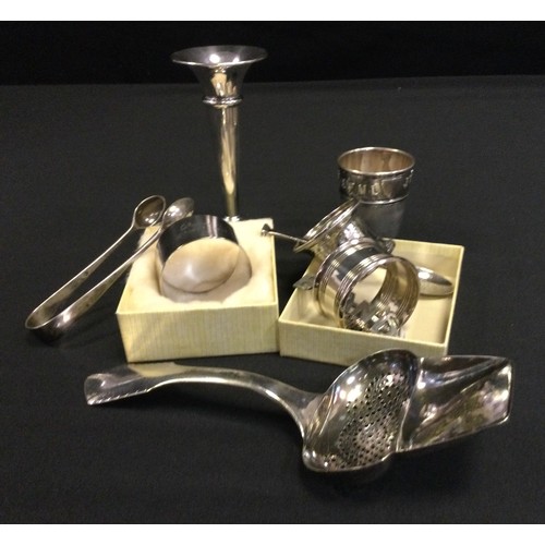 400 - Silver - a George V silver napkin ring, Birmingham 1919;  others;  weighted posy vase, sugar tongs, ... 