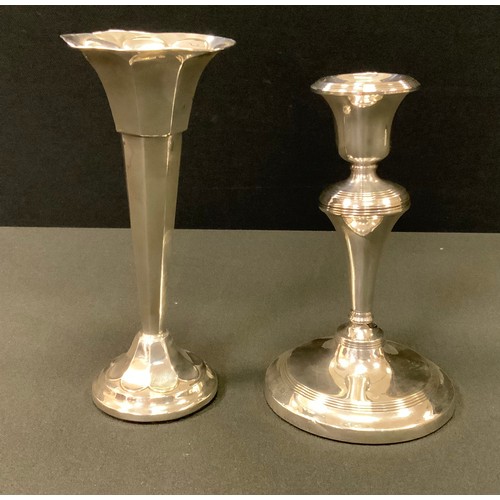 425 - A George V silver candlestick, weighted base, Birmingham 1916;  a bud vase, weighted base, Sheffield... 