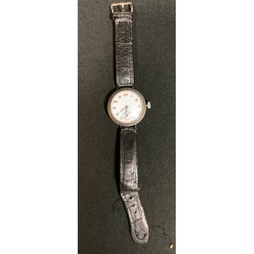 449 - An early 20th century Swiss silver wristwatch, screw cap case with white enamel dial, Arabic numeral... 