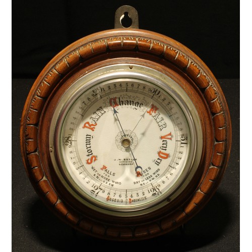 72 - A Victorian walnut aneroid barometer, 12cm register inscribed J W Butler, Optician, Scarborough, the... 