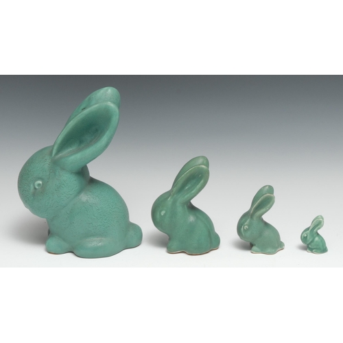 180 - A set of four graduated Bourne Denby Danesby Ware Antique Green matt glazed Marmaduke rabbits, size ... 