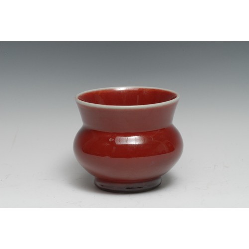 253 - A Chinese monochrome vase, glazed in tones of mottled red, 12.5cm diam