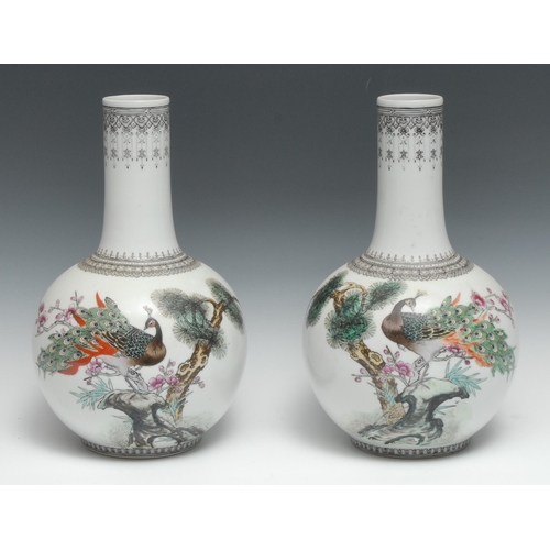 255 - A pair of Chinese Republic ovoid vases, decorated with peacocks and verse, 29.5cm high, red seal mar... 