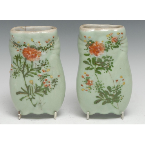 256 - A pair of Chinese celadon wall pockets, moulded decorated in polychrome enamels with flowers, 15cm l... 