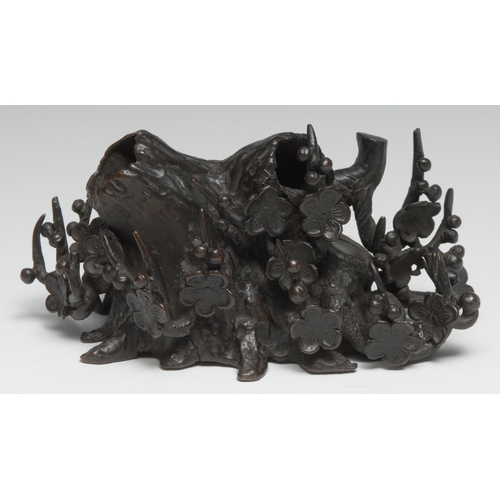 257 - A Chinese bronze scholar's brush stand, cast as a root and blossoming prunus, 17cm wide, 19th centur... 