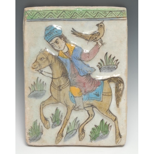 294 - A Middle Eastern Islamic rectangular tile, moulded and painted in the typical Qajar manner with a fa... 