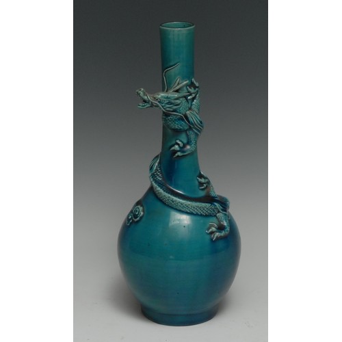 298 - A Japanese Awaji turquoise bottle vase, the neck with coiled three clawed dragon and clouds, 24.5cm ... 