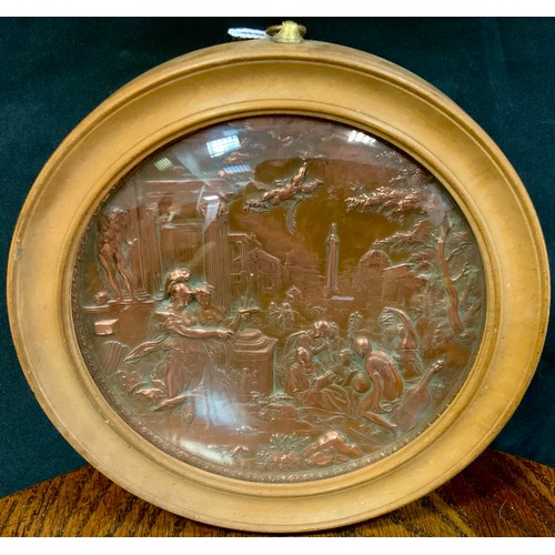 347 - A 19th century coppered metal circular plaque, in relief  with Roman figures and buildings, 18cm dia... 