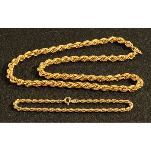 390 - A 9ct gold rope twist necklace;  a similar bracelet, 30g