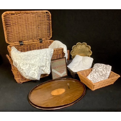 417 - A wicker two handled basket, 58cm wide; lace table cloths; an early 20th century mahogany oval tray,... 