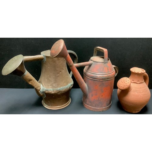 472 - A large 19th century copper watering can, 41cm high;  another tin, painted red;  etc (3)