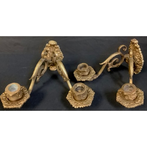 487 - A pair of gilt bronze and brass two branch wall sconces