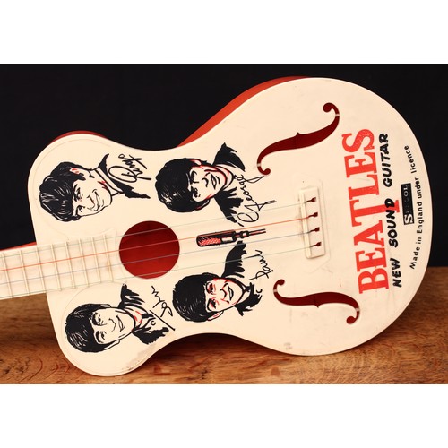 A 1960 s Selcol Beatles new sound novelty toy guitar four strings