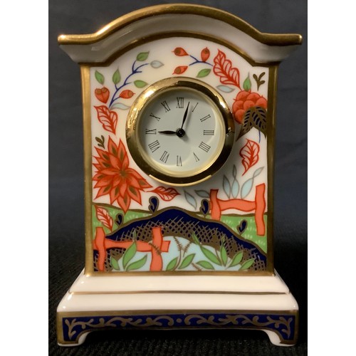 518 - A Royal Crown Derby Haiku pattern miniature clock, first quality, 8cm high