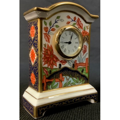 518 - A Royal Crown Derby Haiku pattern miniature clock, first quality, 8cm high