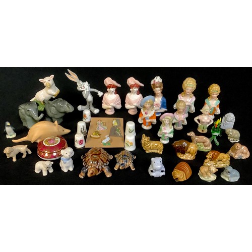 526 - A collection of pincushion dolls; Wade Whimsies and badges; a Limoges box, etc