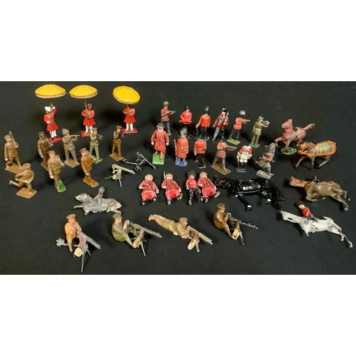 535 - A collection of Britains and other lead soldiers, machine gunners, etc