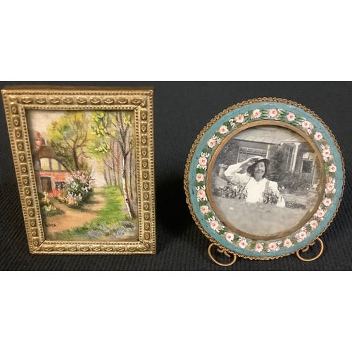 567 - A 19th century micro-mosaic circular frame, 6cm diameter; another miniature frame (2)